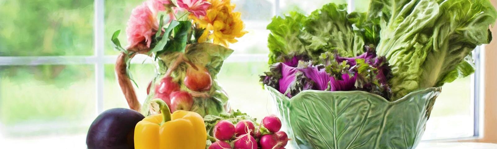 A vibrant display of fresh vegetables and flowers on a sunlit kitchen table by the window.