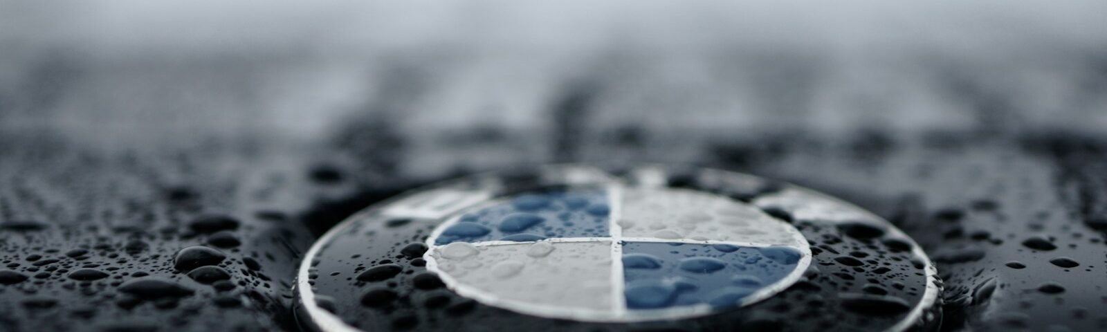 shallow focus photo BMW logo